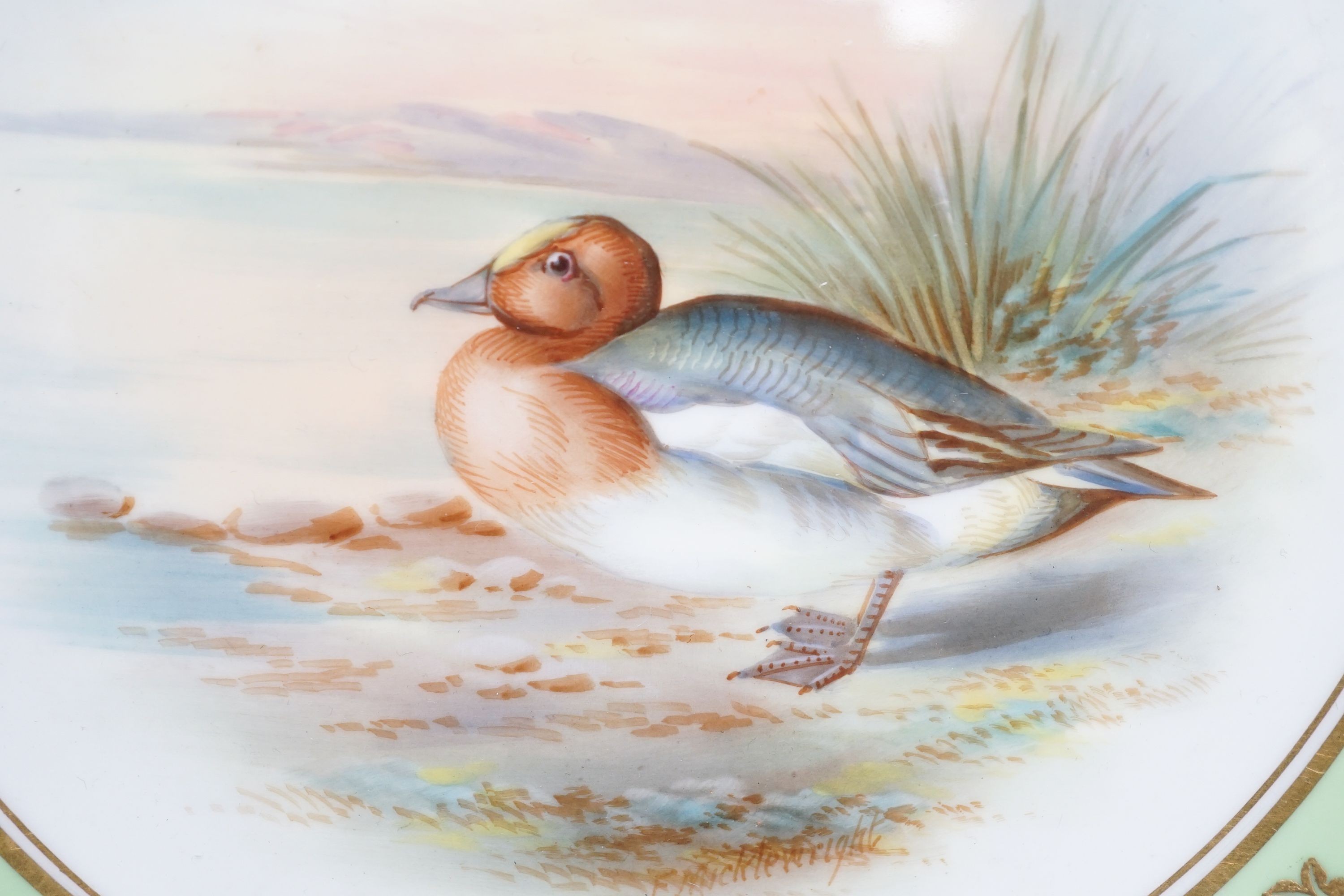 A late 19th century Aynsley pair of plates painted by F. Micklewright each signed, with a Widgeon or Wood Pigeon named verso 22cm